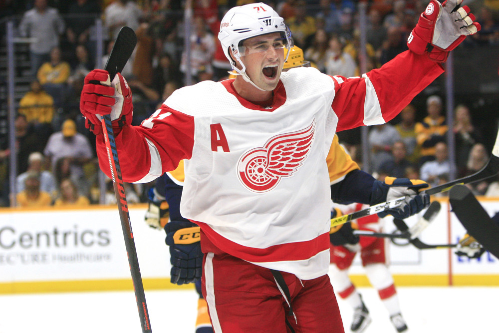 NASHVILLE, TN - OCTOBER 05: Detroit Red Wings center Dylan Larkin (71) celebrates a Detroit goal during the NHL game between the Nashville Predators and Detroit Red Wings, held on October 5, 2019, at Bridgestone Arena in Nashville, Tennessee. (Photo by Danny Murphy/Icon Sportswire)